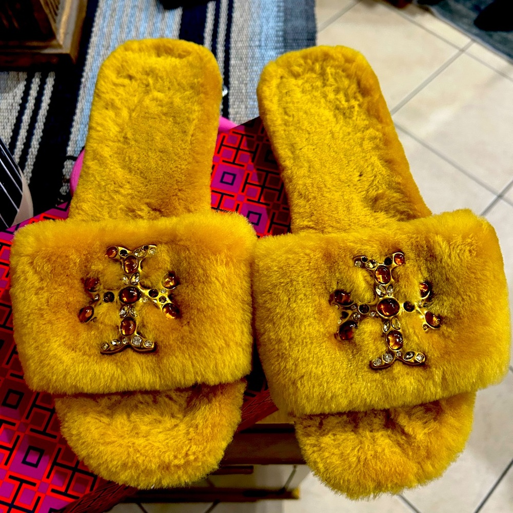 Gently used Tory Burch shoes that can be worn as slippers or sexy outdoor shoes.